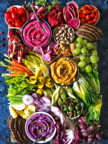 beet hummus, butternut and sweet potato hummus on crudites platter