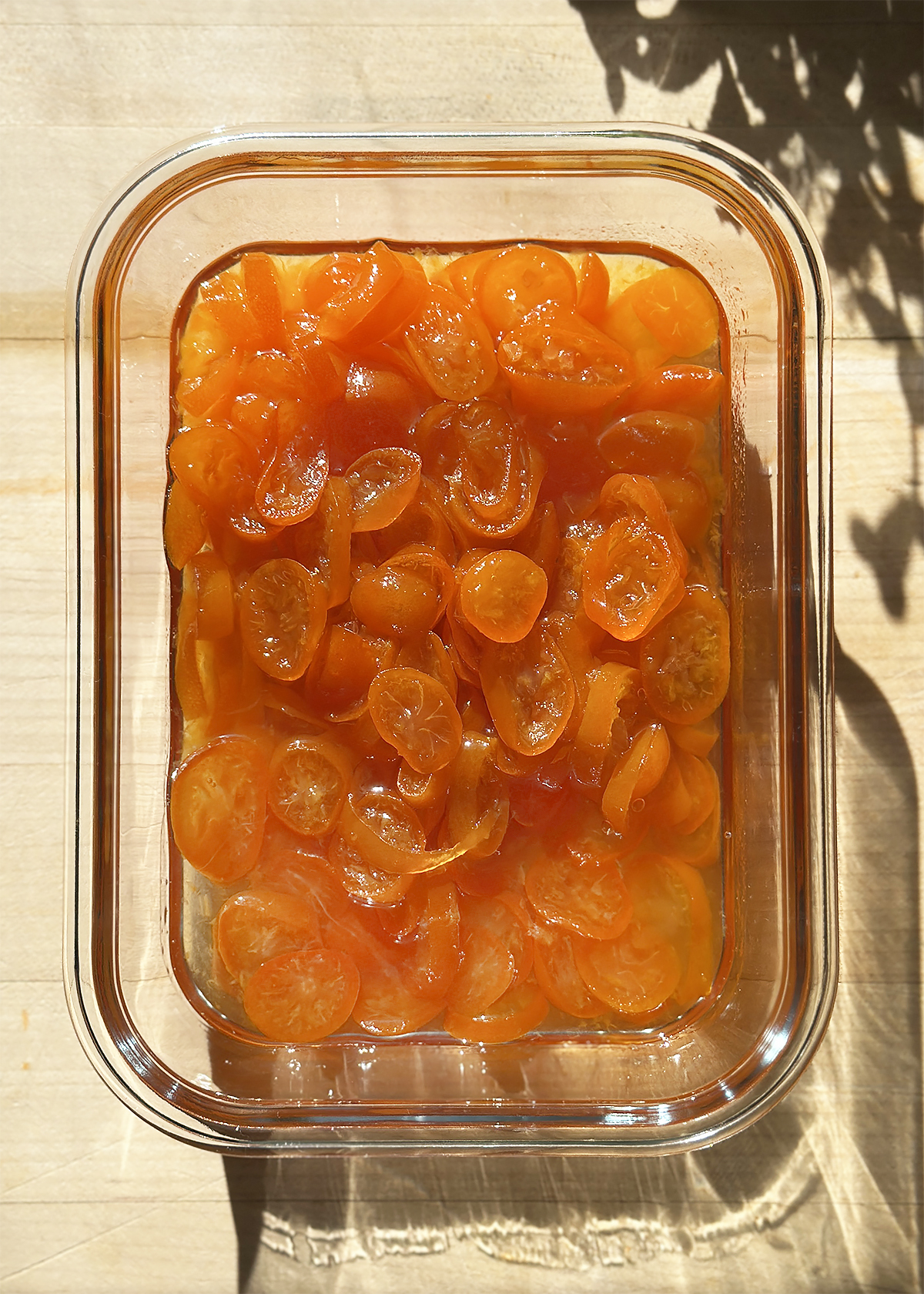 candied kumquats in glass container