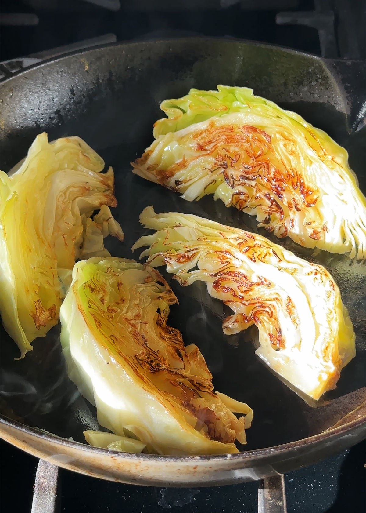 charred cabbage in skillet