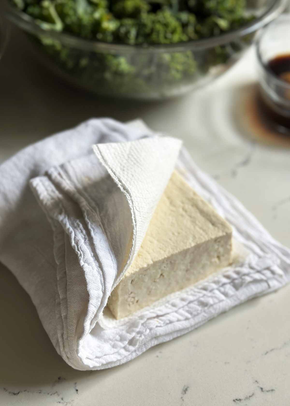 firm tofu between paper towels to drain