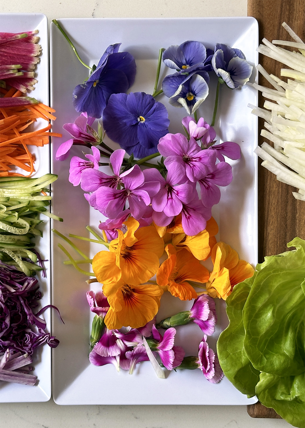 edible flowers on white tray