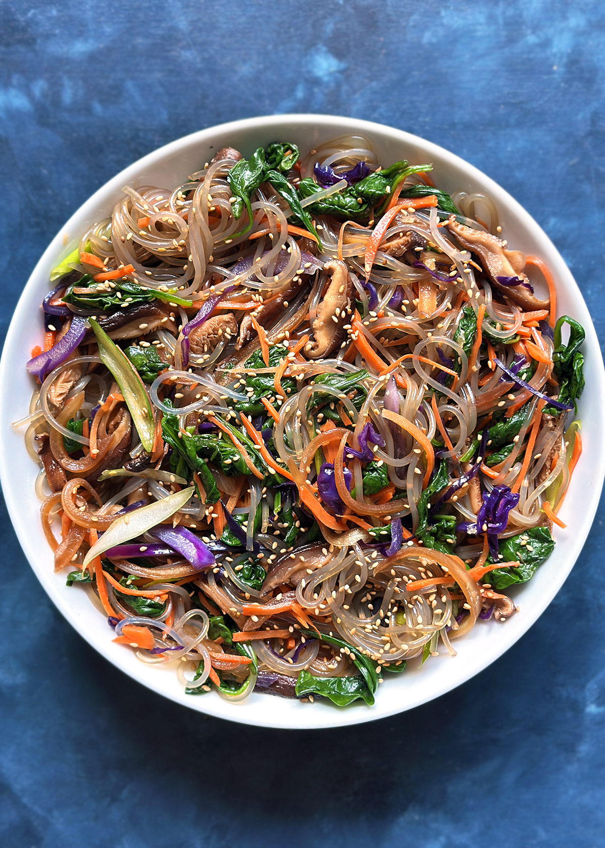 jap chae in round serving bowl