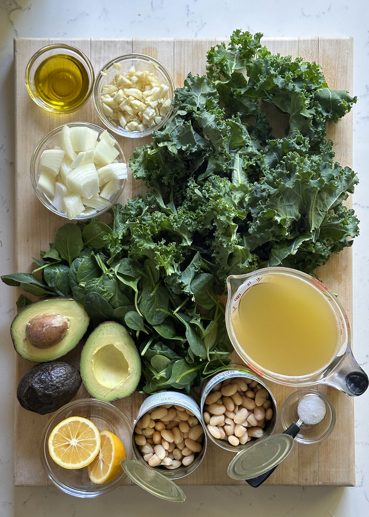 kale white bean soup ingredients prepped on board