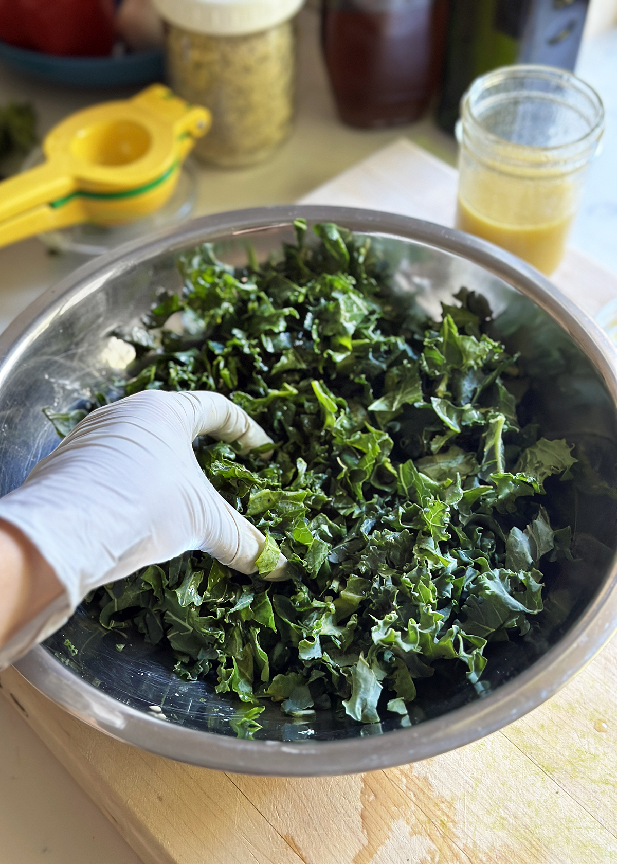 massaging chopped kale by hand