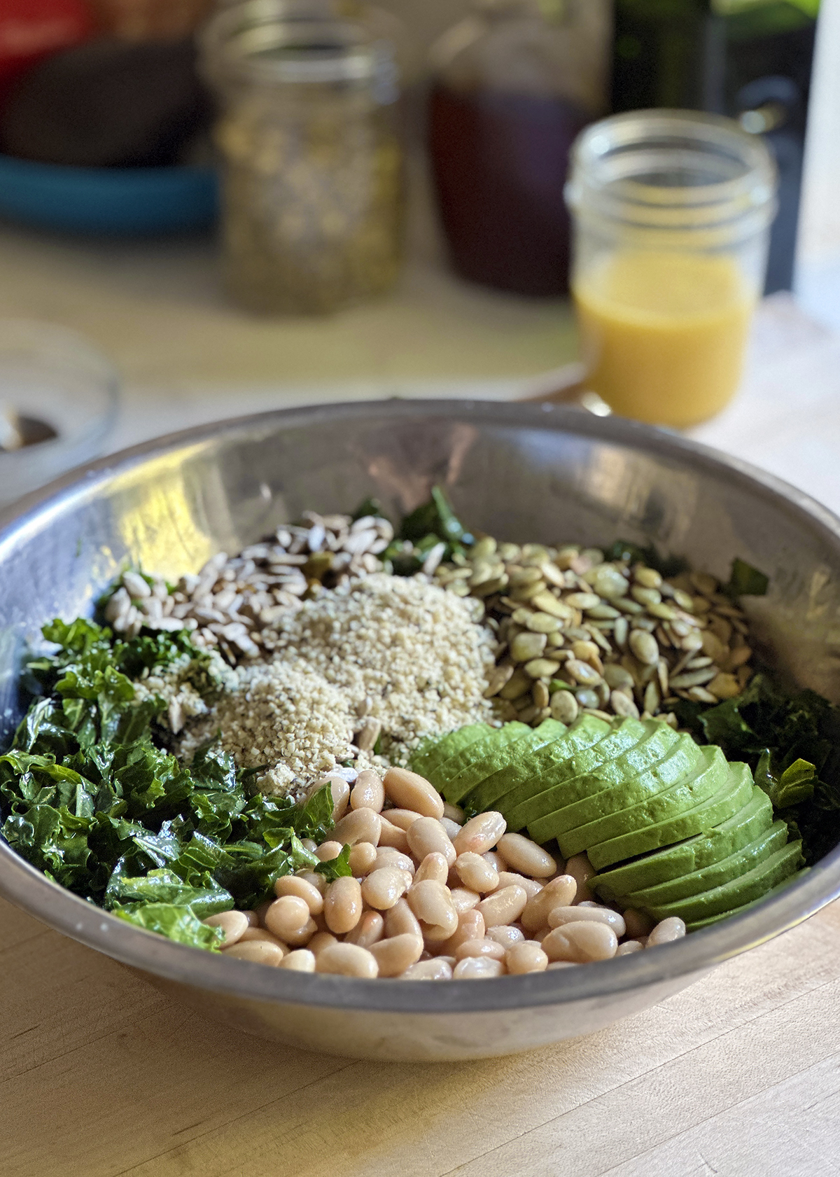 kale white bean salad all ingredients in bowl