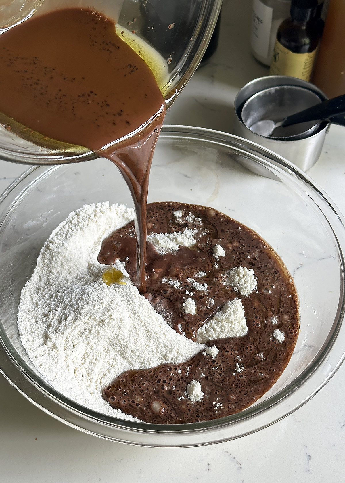 adding liquid cocoa ingredients to dry