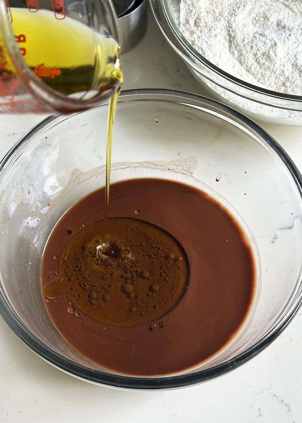 oil-streaming into mixing bowl