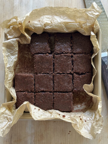 olive oil brownies baked and cut in square pan