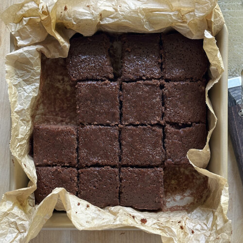 olive oil brownies baked and cut in square pan