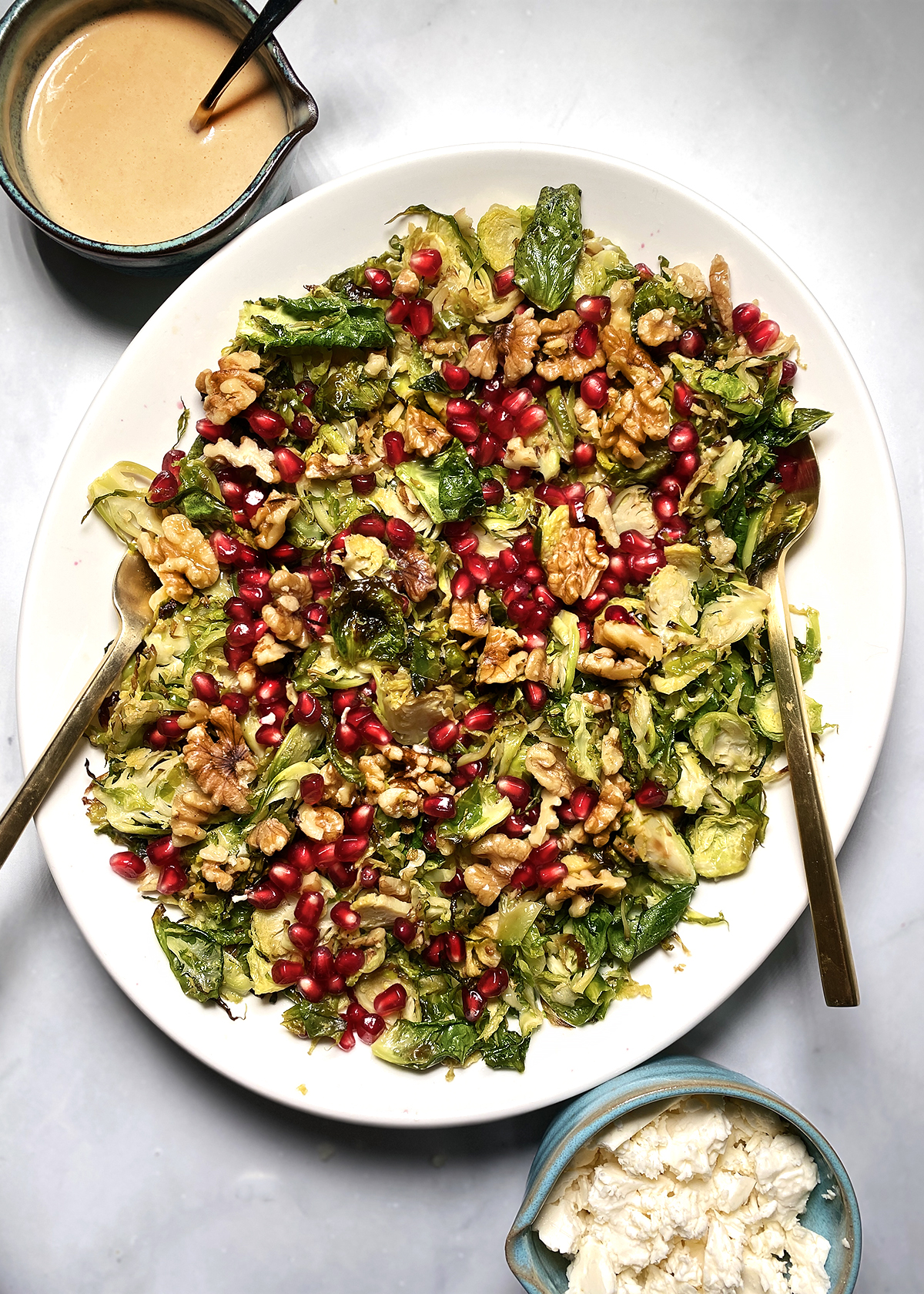 shredded brussels sprouts salad with pomegranate and walnuts