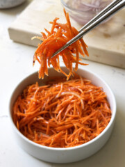 spicy carrot salad on chopsticks