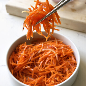 spicy carrot salad on chopsticks