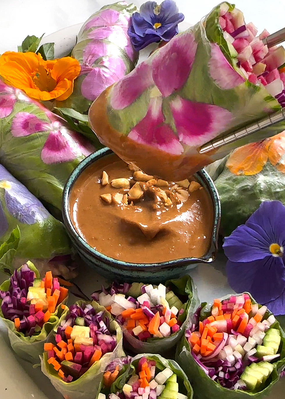 spring roll piece dipping in sauce