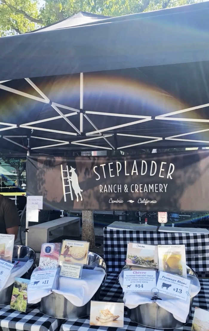 stepladder ranch and creamery cheese at farmers market stand